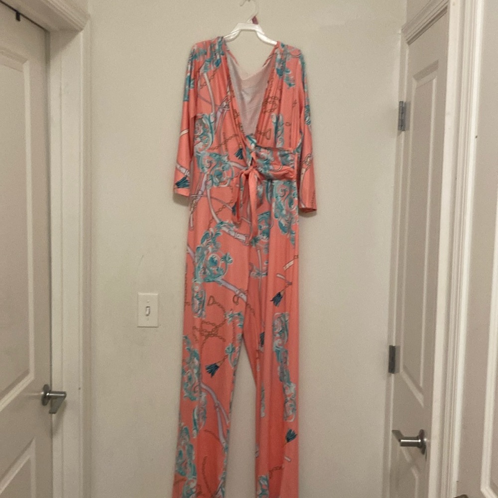 Pink printed Jumpsuit with tie around belt.